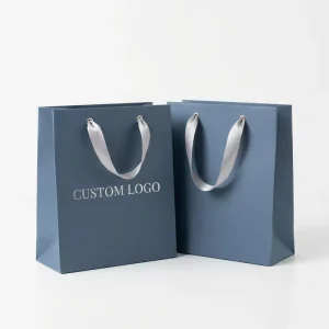 Aesthetic Minimalist Custom Logo Paper Bags with Ribbon Handles for Boutique Luxury Apparel and Accessory Packaging