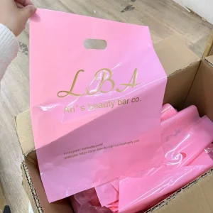 Custom Bags With Logo Pink Plastic Waterproof Cloth Retail Shopping Bag Printed Die Cut Plastic Shopping Bag With Handle