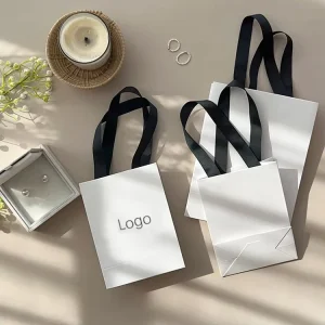 Custom Luxury White Card Paper Bag with Gold Foil logo for Shopping Gift Clothing Garment Dress Packaging Bag with Handle