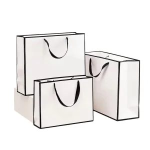 Eco-Friendly White Cardboard Paper Gift Bags Boutique Foldable with Handle for Clothing Packaging Customizable Logo