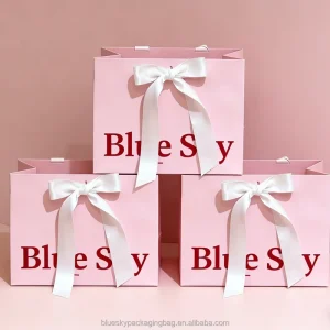 Light Pink Medium Paper Bag with Bow Ribbon Decoration for High End Dresses and Coats Packaging Bags