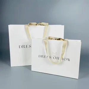 Luxury Beauty Gold Foil Gift Paper Bag Jewelry Packaging Bags With Gold Ribbon