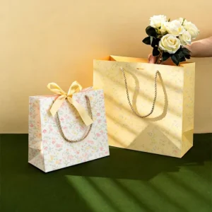 Luxury Durable Eco Friendly Handmade Craft Flower Printed Lamination Custom Logo White Cardboard Gift Bags Ribbon Bow