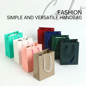 Printed Luxury Gift Paper Bag Packaging With Customized Handheld Perforated Paper Bags for Clothing Store Gift