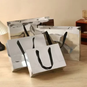 Varnishing Paper Bag Custom Luxury Silver Reflective Shopping Bags Ribbon Handles Custom Logo Clothing Gift Paper Bags